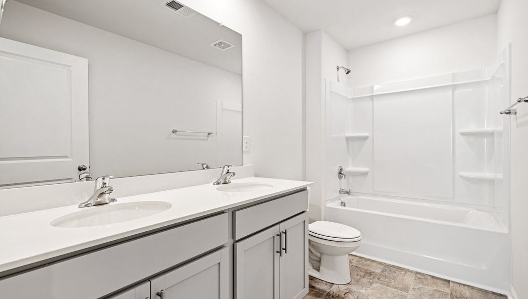 Furnished interior view inside a new home in Paddock Point, Roebuck (Image 11).