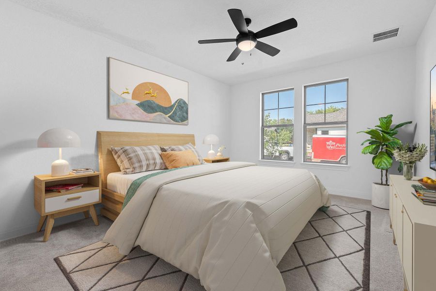 Bedroom with light colored carpet and a ceiling fan Bedroom with light colored carpet and a ceiling fan