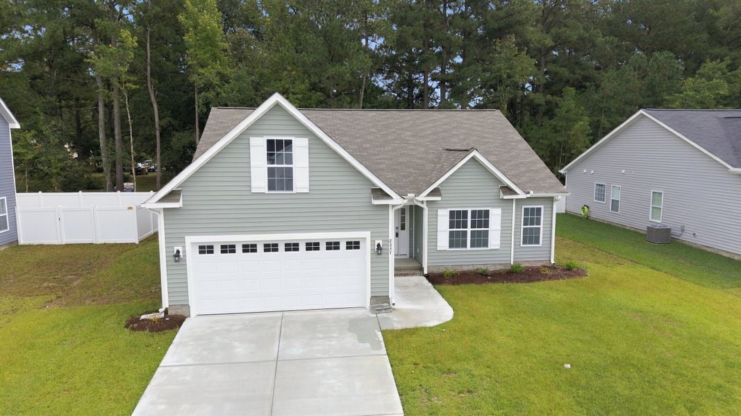 Front exterior of a new home in Davenport Farms, Winterville, NC, highlighting curb appeal (Image 18).