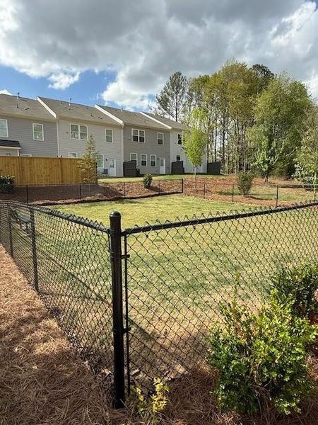 Front exterior of a new home in East Park Village, Kennesaw, GA, highlighting curb appeal (Image 32).