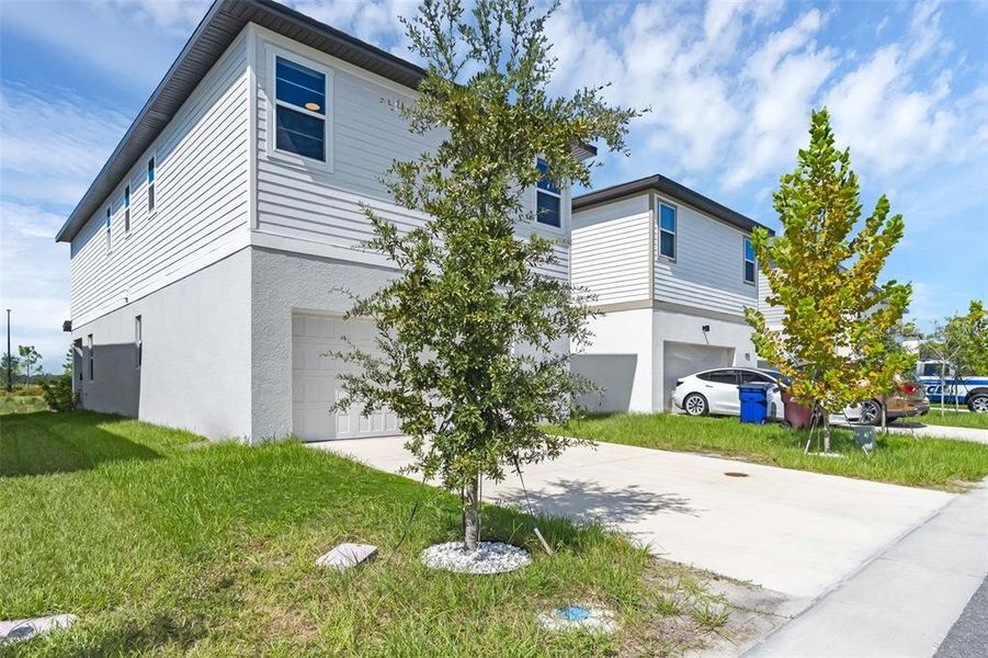 Front exterior of a new home in , St. Cloud, FL, highlighting curb appeal (Image 23).