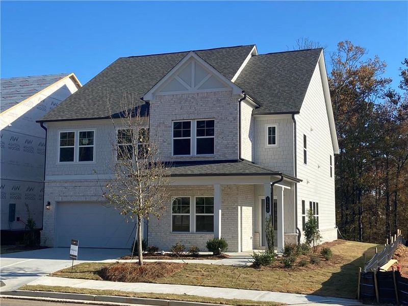 Front exterior of a new home in Arbors at Richland Creek, Buford, GA, highlighting curb appeal (Image 1).