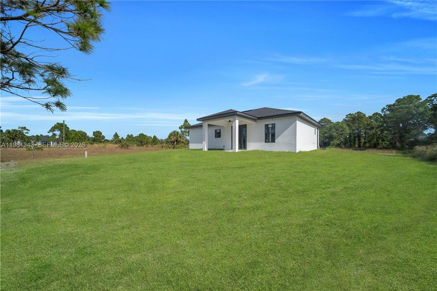Exterior details and patio area of a home in , Lehigh Acres (Image 3).
