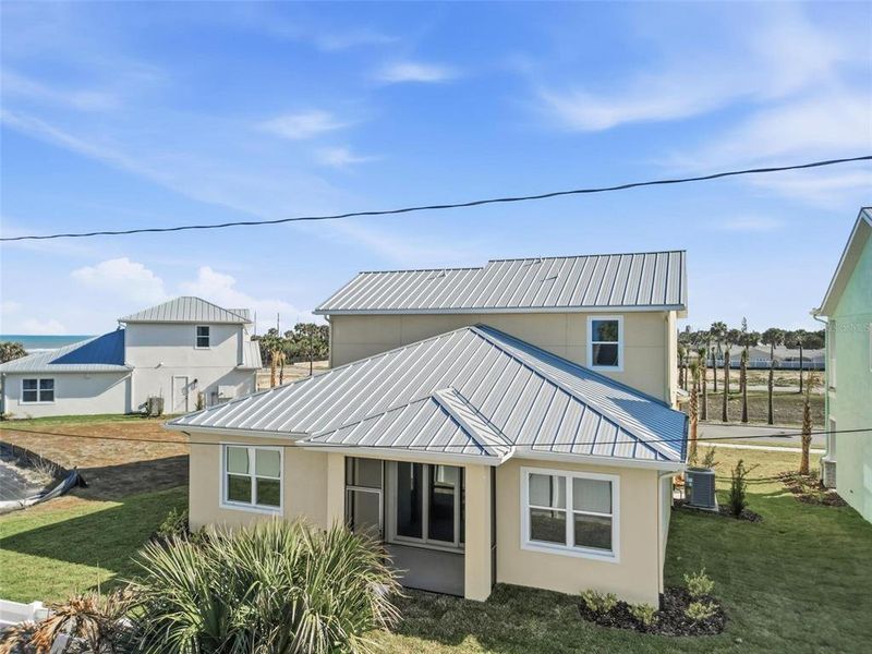 Exterior details and patio area of a home in Beachview Cove, Ormond Beach (Image 14).