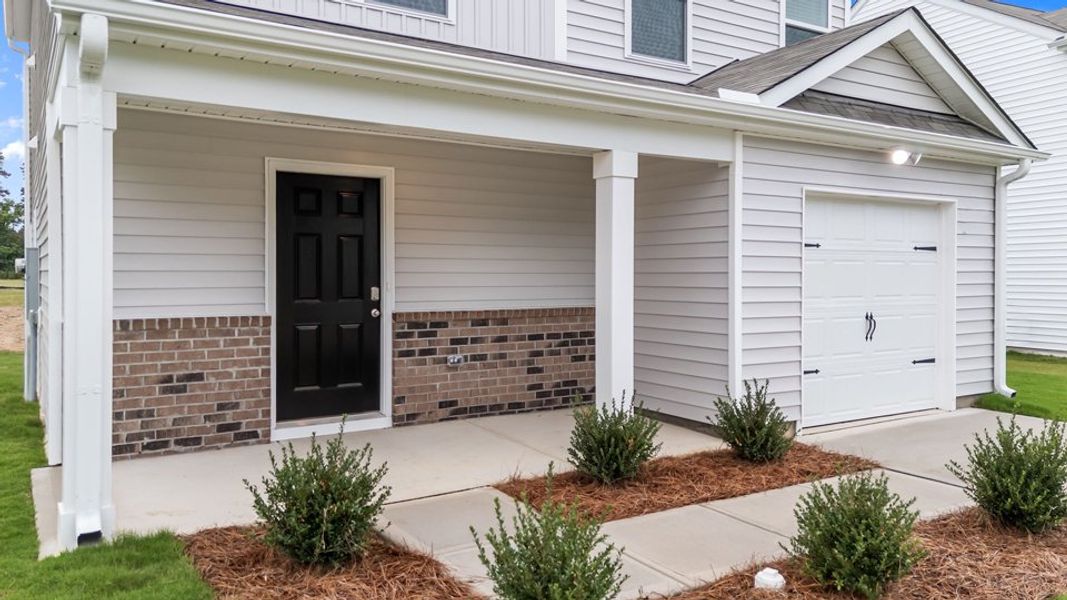 Exterior details and patio area of a home in Hobbs Farm, Ayden (Image 3).