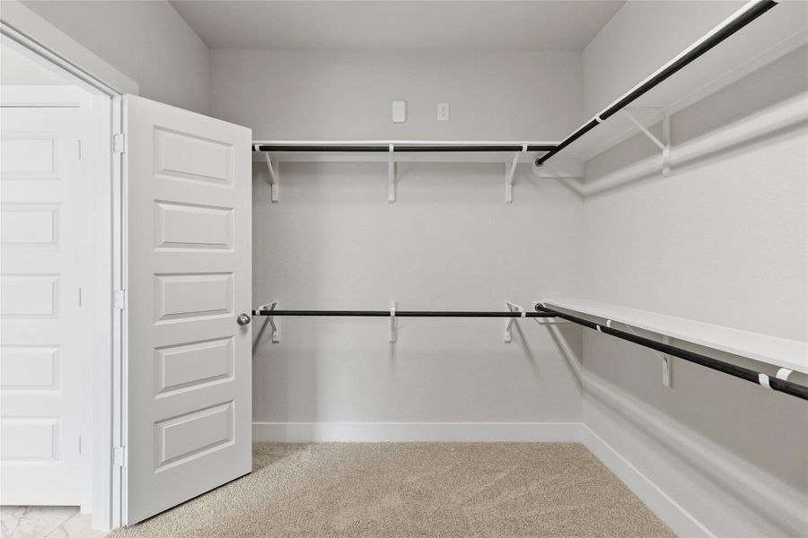 Welcome to your generous walk-in closet with extensive hanging space and storage options provides exceptional organization for wardrobes and seasonal items.