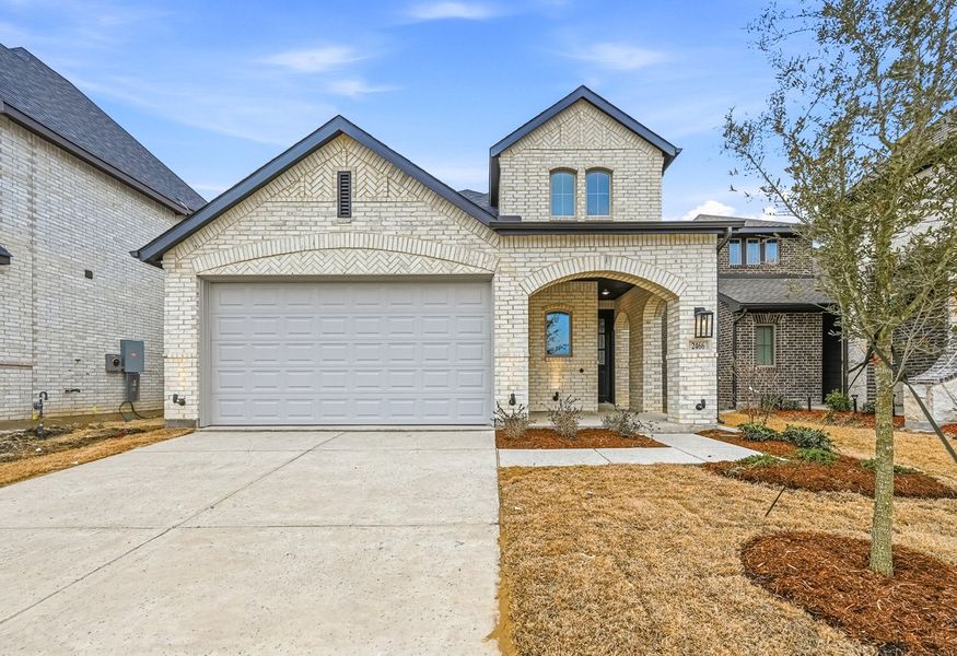 Front exterior of a new home in Creekshaw, Royse City, TX, highlighting curb appeal (Image 1). Front exterior of a new home in Creekshaw, Royse City, TX, highlighting curb appeal (Image 1).