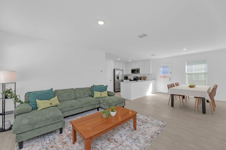 Living room with vinyl flooring.