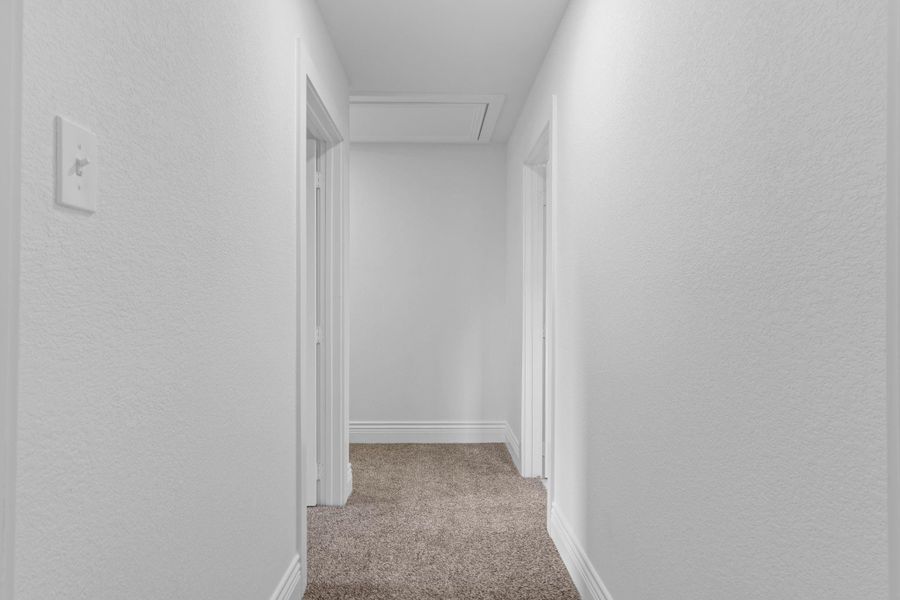 The hallway upstairs is clean and simple creating an easy flow between the bedrooms and bathrooms. A wonderful layout that keeps everything feeling open. The hallway upstairs is clean and simple creating an easy flow between the bedrooms and bathrooms. A wonderful layout that keeps everything feeling open.