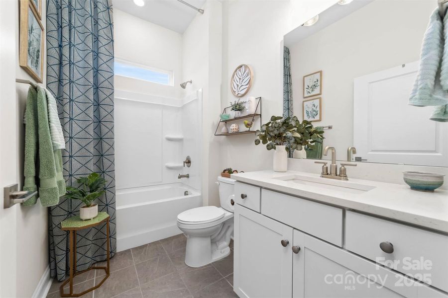 Secondary full bathroom on main level