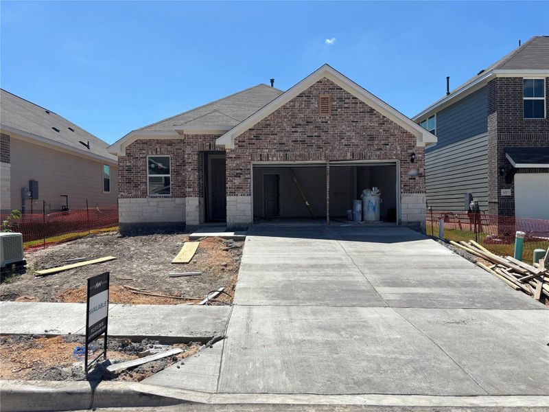 Front exterior of a new home in Covered Bridge, Hutto, TX, highlighting curb appeal (Image 17). Front exterior of a new home in Covered Bridge, Hutto, TX, highlighting curb appeal (Image 17).