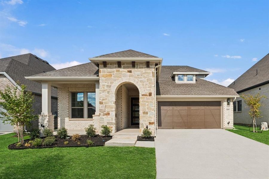 View of front of house featuring a shingled roof, stone siding, a front yard, driveway, and an attached garage View of front of house featuring a shingled roof, stone siding, a front yard, driveway, and an attached garage