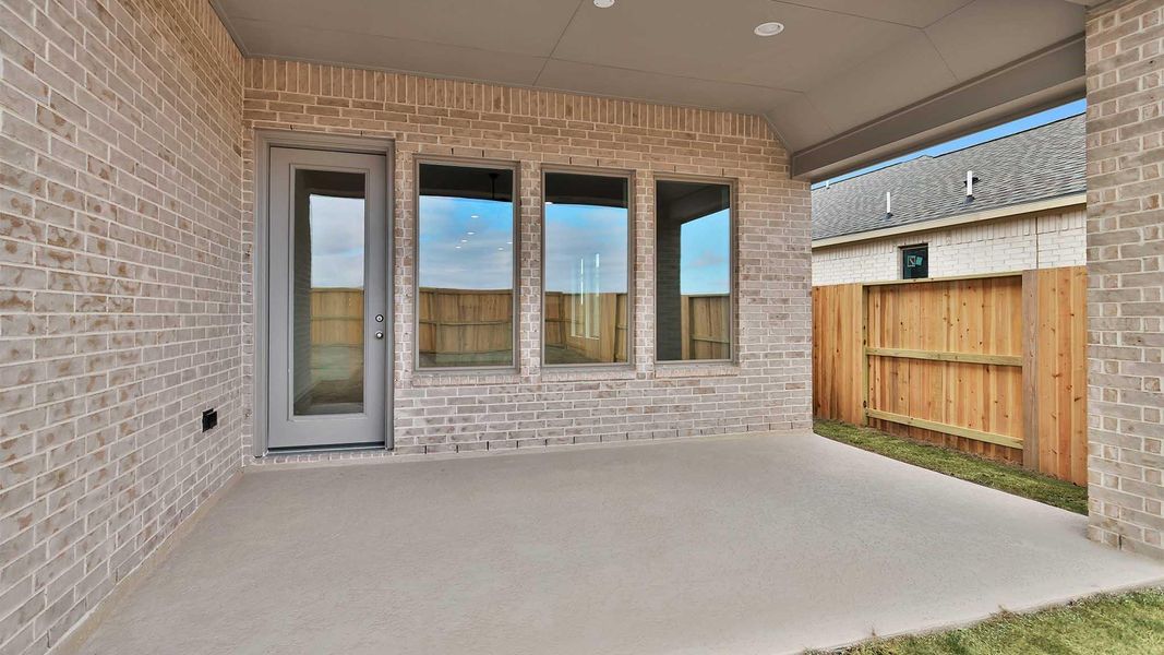 Exterior details and patio area of a home in Meridiana, Manvel (Image 4).