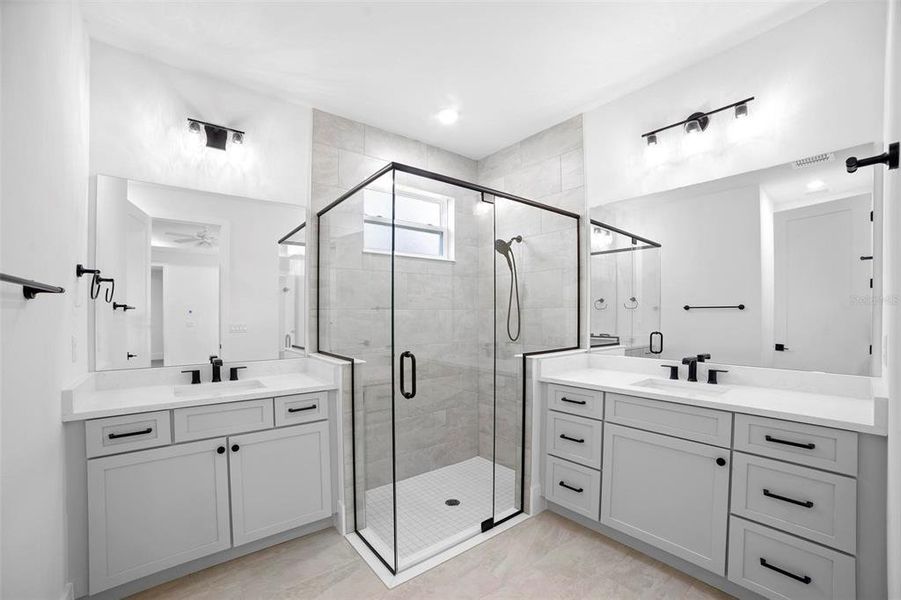 Master Bathroom with dual vanities and custom glass shower enclosure