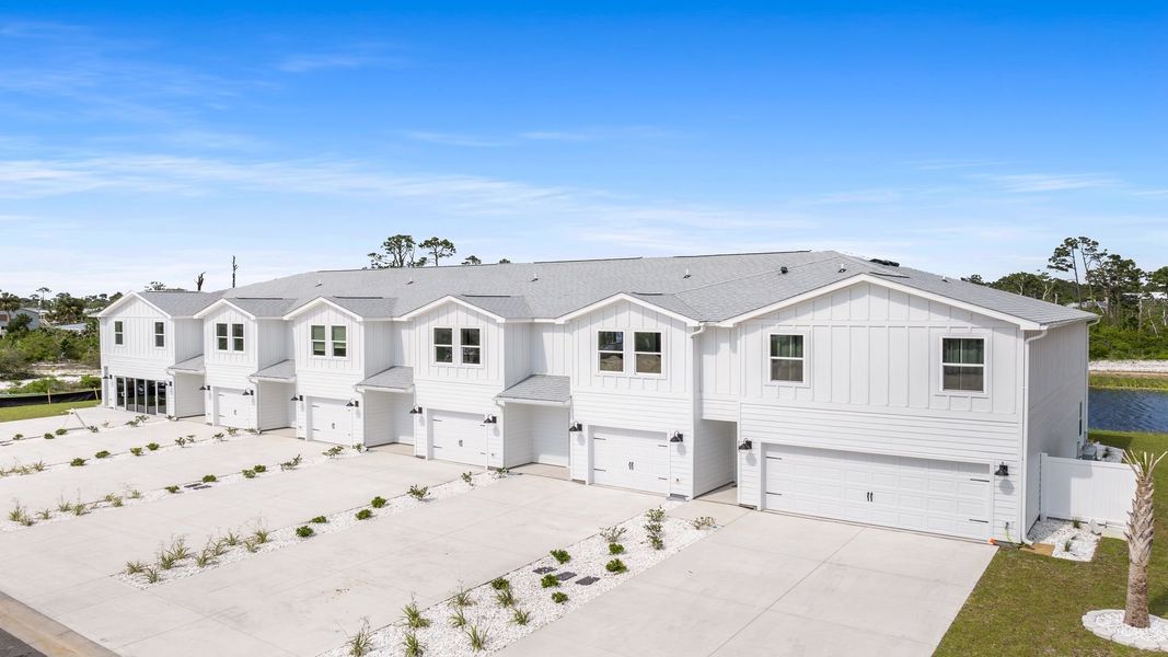 Front exterior of a new home in WindMark Beach, Port Saint Joe, FL, highlighting curb appeal (Image 19). Front exterior of a new home in WindMark Beach, Port Saint Joe, FL, highlighting curb appeal (Image 19).