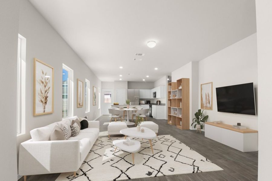 Image of a living room rendering with white furniture, a rug, an entertainment center, mounted TV and wall decor