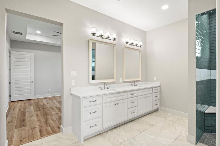 Full bathroom featuring double vanity, walk in shower, and recessed lighting Full bathroom featuring double vanity, walk in shower, and recessed lighting