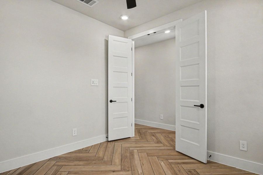 Additional view of the study. Upgraded double doors were added along with an additional floor outlet. Ceiling fan added for comfort. Additional view of the study. Upgraded double doors were added along with an additional floor outlet. Ceiling fan added for comfort.