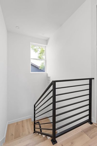 Stairway with wood finished floors and baseboards Stairway with wood finished floors and baseboards