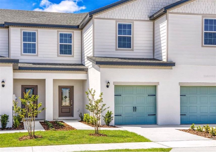 Front exterior of a new home in Sol Vista, Dundee, FL, highlighting curb appeal (Image 20).