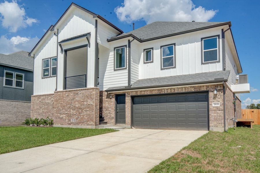 Front exterior of a new home in Townsen Landing, Humble, TX, highlighting curb appeal (Image 21).