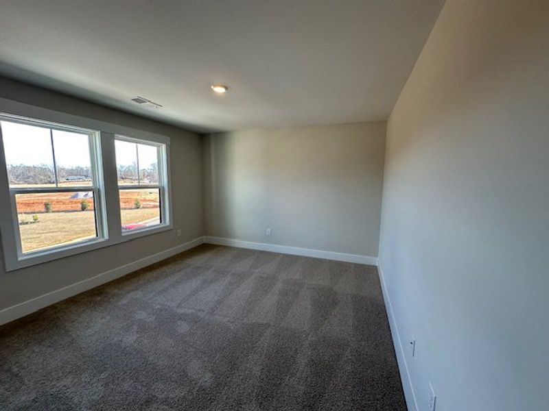 This spacious room features ample natural light an
