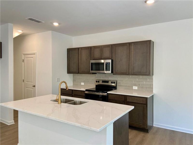 Furnished interior view inside a new home in Eastlyn Crossing, Flowery Branch (Image 7). Furnished interior view inside a new home in Eastlyn Crossing, Flowery Branch (Image 7).
