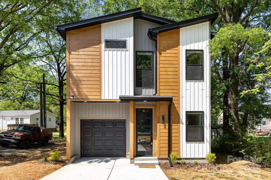 Front exterior of a new home in , Concord, NC, highlighting curb appeal (Image 14).