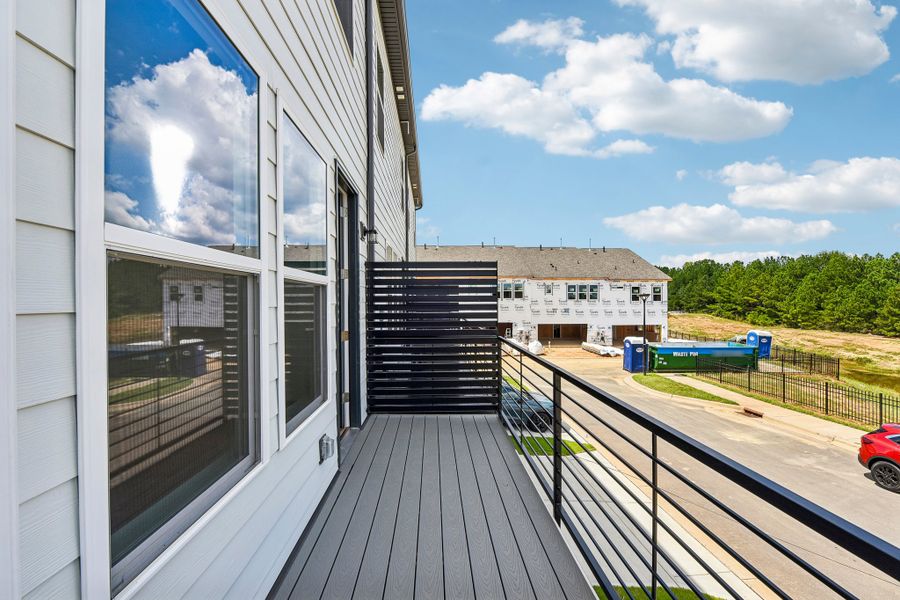 Exterior details and patio area of a home in Indian Trail Townhomes, Indian Trail (Image 4).