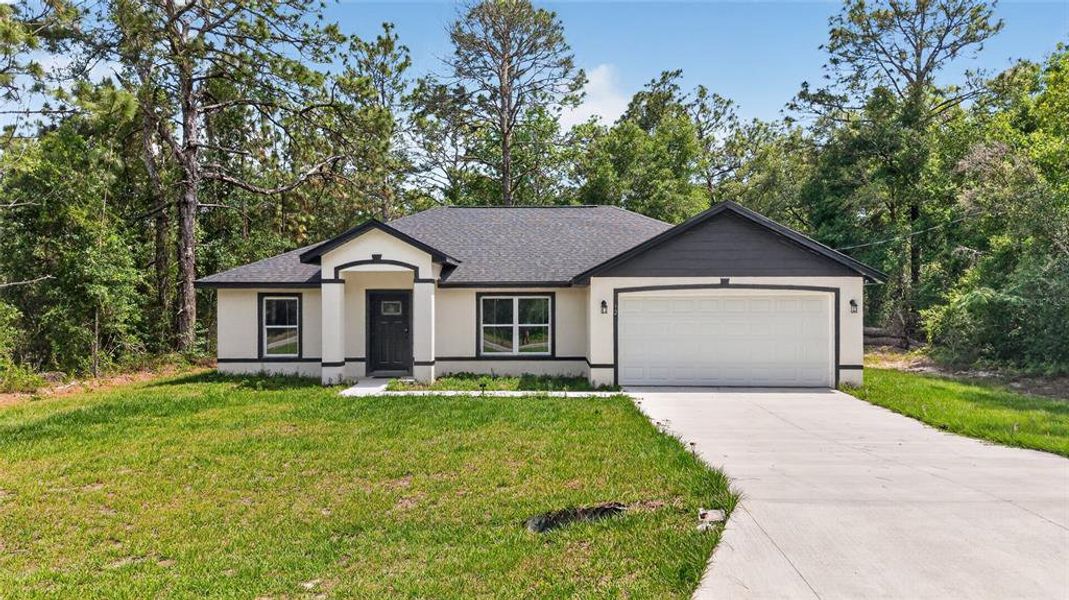 Front exterior of a new home in , Ocklawaha, FL, highlighting curb appeal (Image 24).