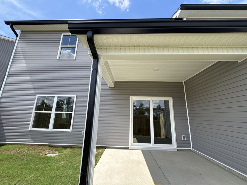 Exterior details and patio area of a home in Caroleton Townhomes, Grovetown (Image 4).