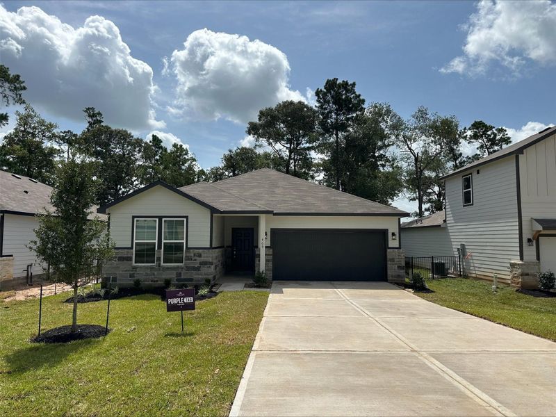 Front exterior of a new home in Lakes at Crockett Martin, Conroe, TX, highlighting curb appeal (Image 18).