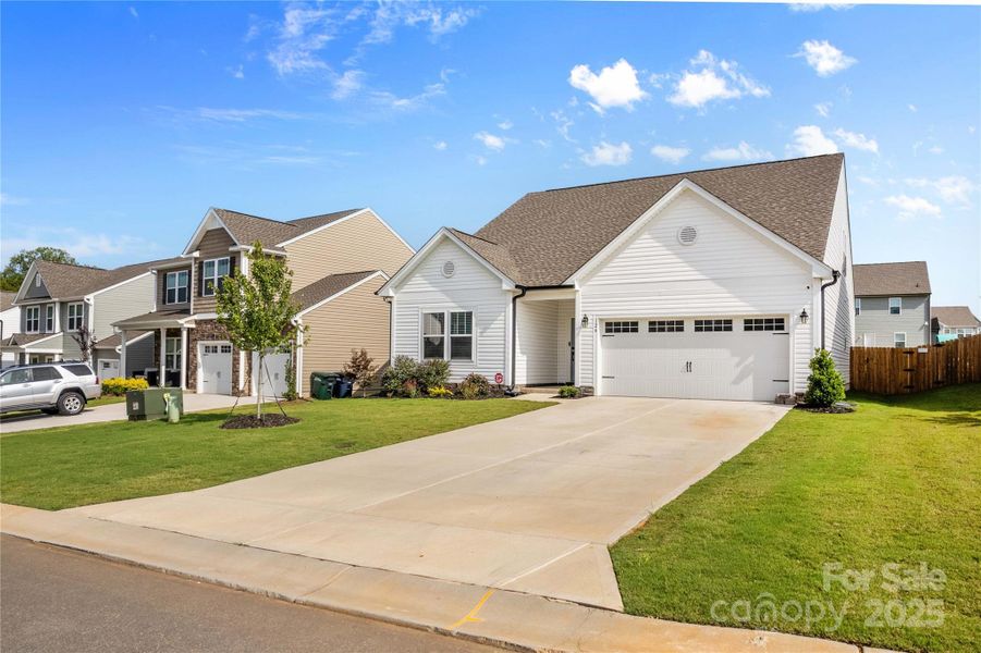 Front exterior of a new home in , Troutman, NC, highlighting curb appeal (Image 28).