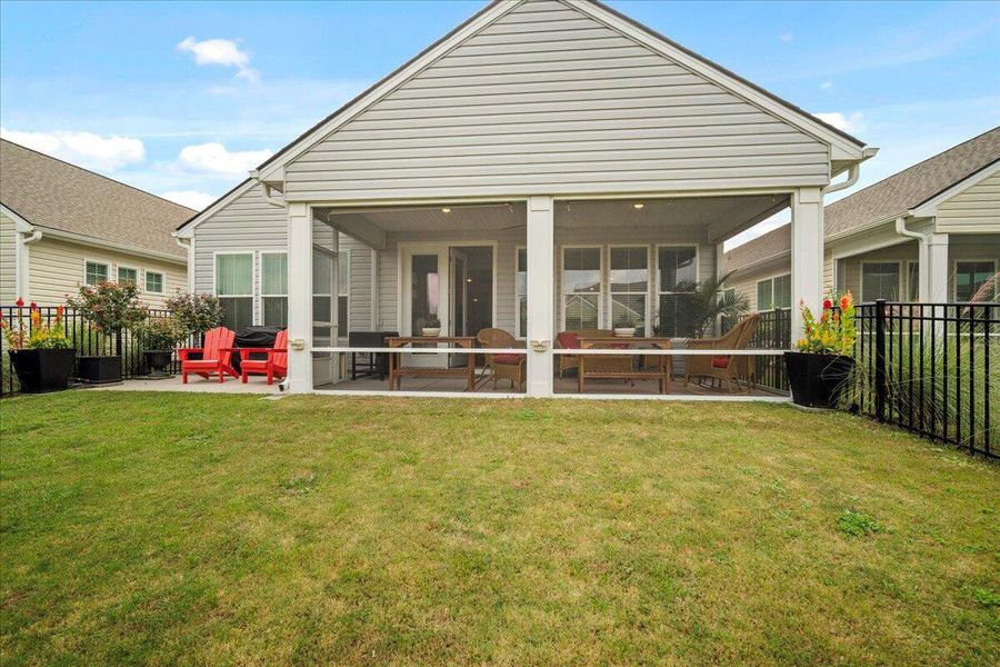Front exterior of a new home in K. Hovnanian's® Four Seasons at Lakes of Cane Bay, Summerville, SC, highlighting curb appeal (Image 26).
