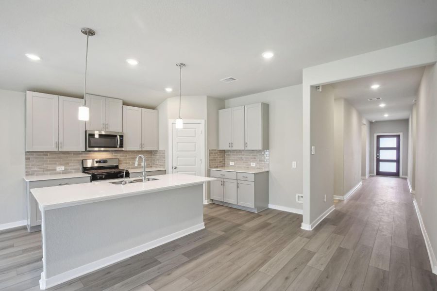 Furnished interior view inside a new home in Massey Oaks - Premier Series, Pearland (Image 14). Furnished interior view inside a new home in Massey Oaks - Premier Series, Pearland (Image 14).