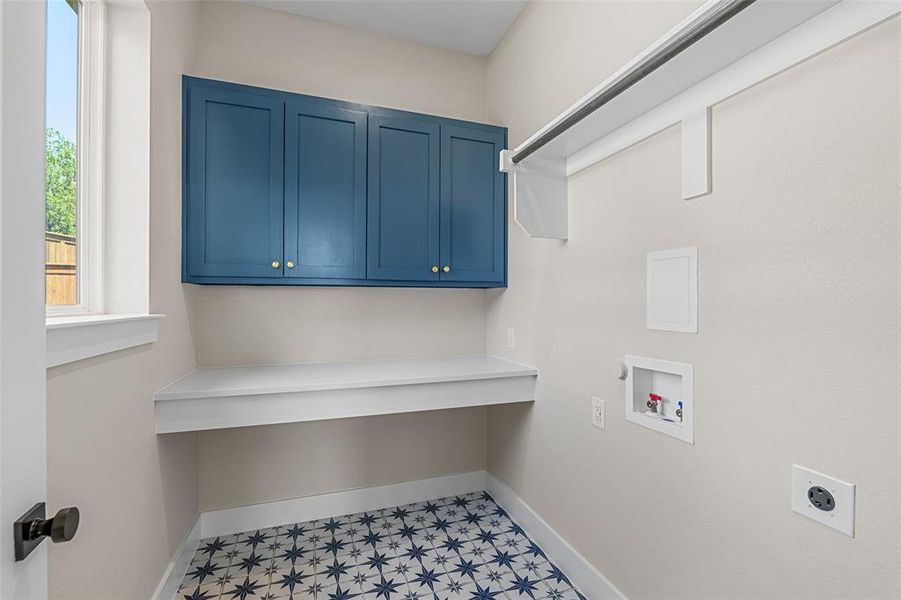 Laundry area featuring washer hookup, cabinets, and hookup for an electric dryer