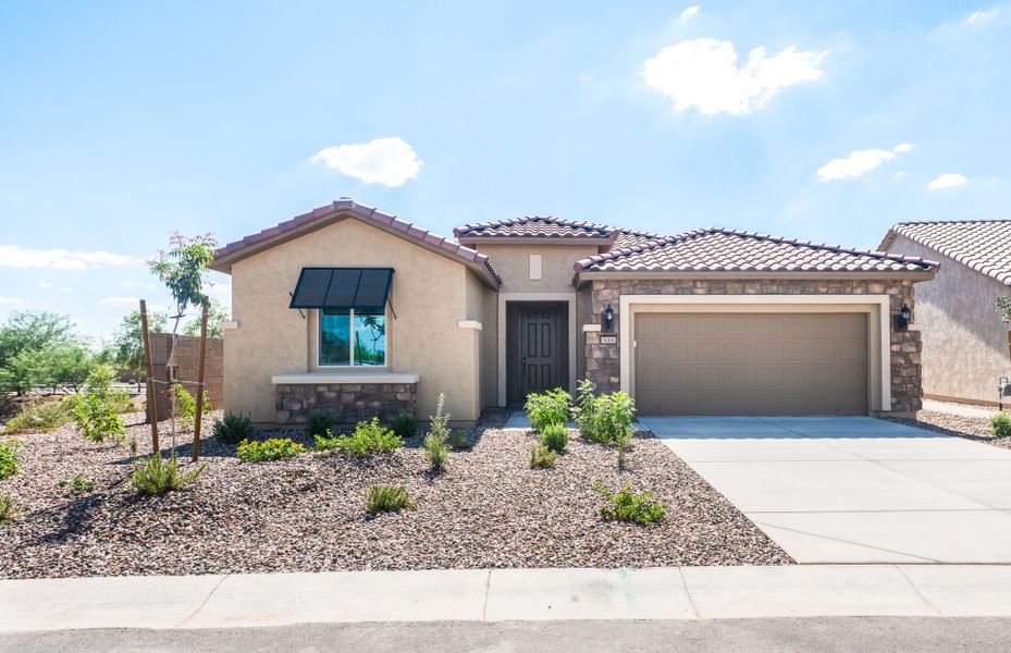 Front exterior of a new home in Sun City Anthem at Merrill Ranch, Florence, AZ, highlighting curb appeal (Image 2). Front exterior of a new home in Sun City Anthem at Merrill Ranch, Florence, AZ, highlighting curb appeal (Image 2).