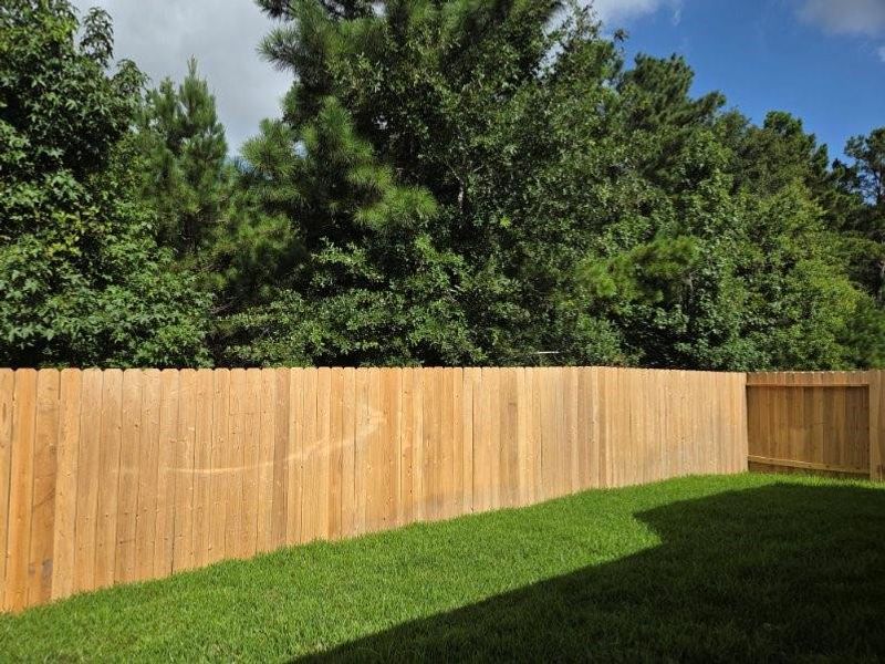 Exterior details and patio area of a home in River's Edge, Conroe (Image 3).