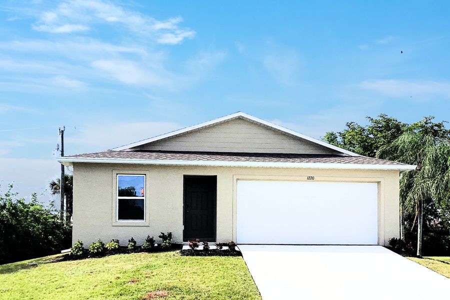 Front exterior of a new home in Cape Coral Signature, Cape Coral, FL, highlighting curb appeal (Image 1). Front exterior of a new home in Cape Coral Signature, Cape Coral, FL, highlighting curb appeal (Image 1).