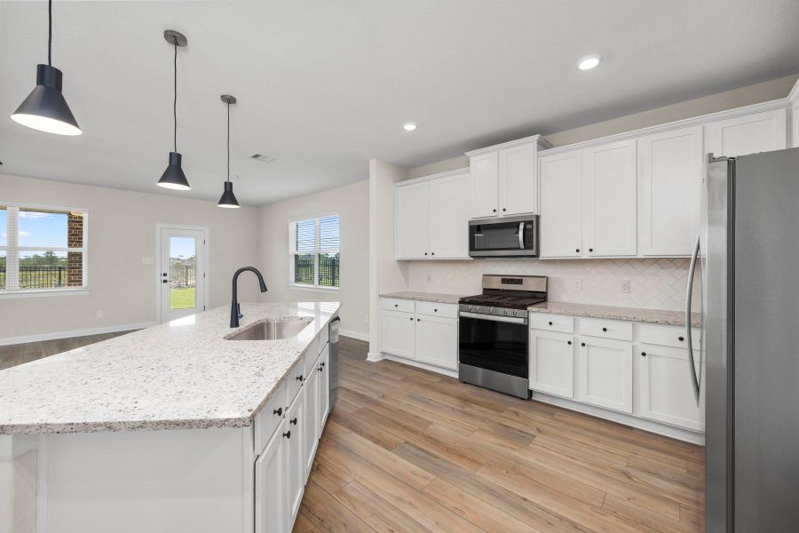Furnished interior view inside a new home in Sunterra, Katy (Image 6).