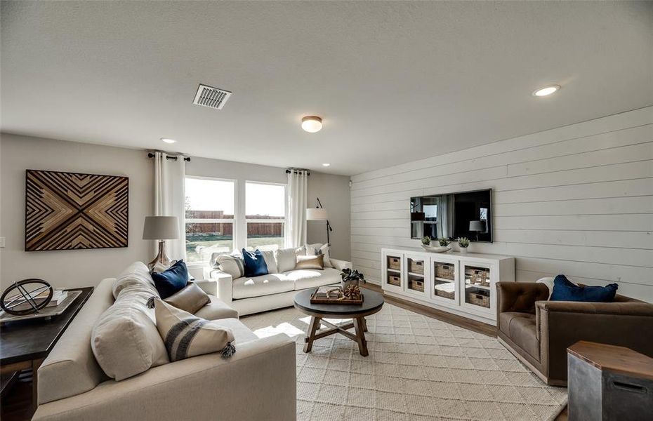 *Model Representation - Spacious gathering room with large windows