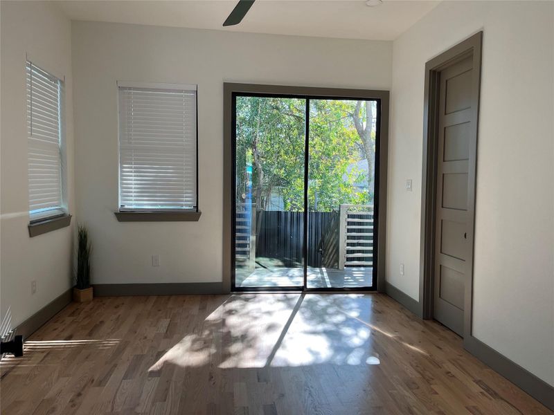 Sliding glass doors lead to a covered back patio off the primary suite. Sliding glass doors lead to a covered back patio off the primary suite.