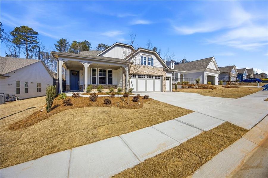 Front exterior of a new home in Cresswind Georgia at Twin Lakes, Hoschton, GA, highlighting curb appeal (Image 2). Front exterior of a new home in Cresswind Georgia at Twin Lakes, Hoschton, GA, highlighting curb appeal (Image 2).