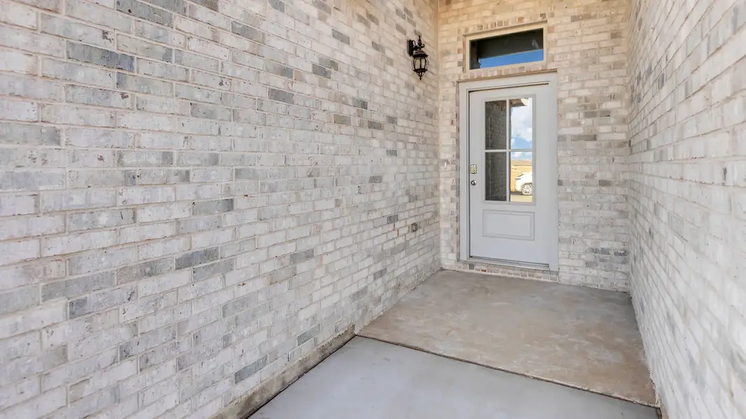 Exterior details and patio area of a home in Overlook West, Wolfforth (Image 3).