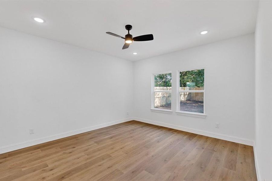 Spare room with light wood-type flooring, recessed lighting, and a ceiling fan