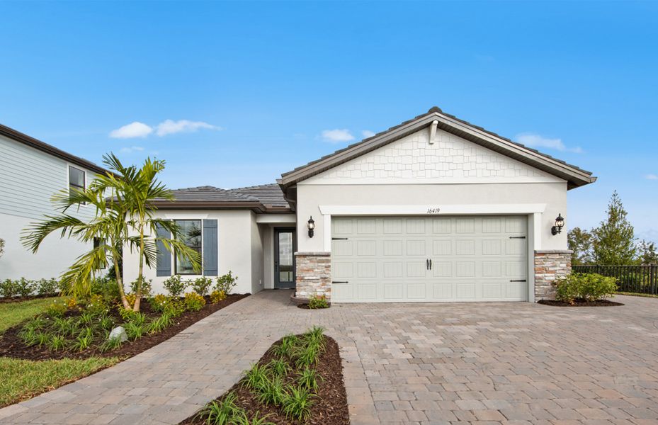 Representative exterior photo of a completed home built from the Mystique by Centex in Cedar Grove at The Woodlands, North Port, FL (Image 23). Representative exterior photo of a completed home built from the Mystique by Centex in Cedar Grove at The Woodlands, North Port, FL (Image 23).