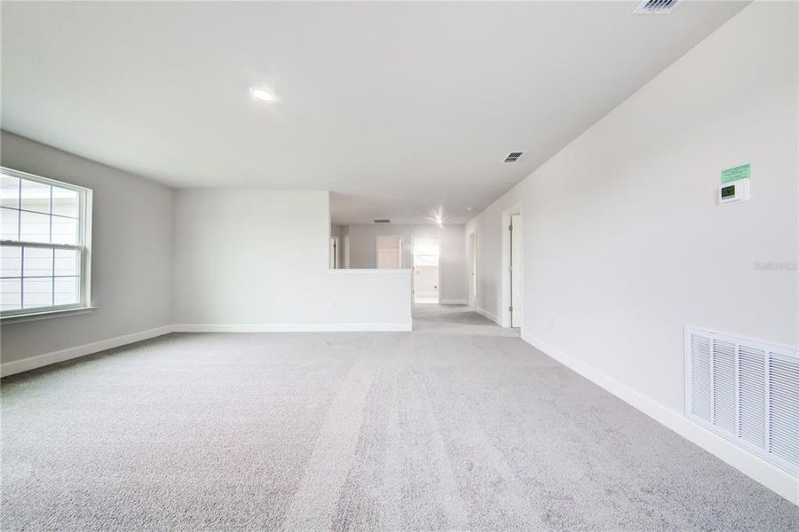 Spacious, unfurnished interior of a new home in Aviary at Rutland Ranch, Parrish (Image 16).