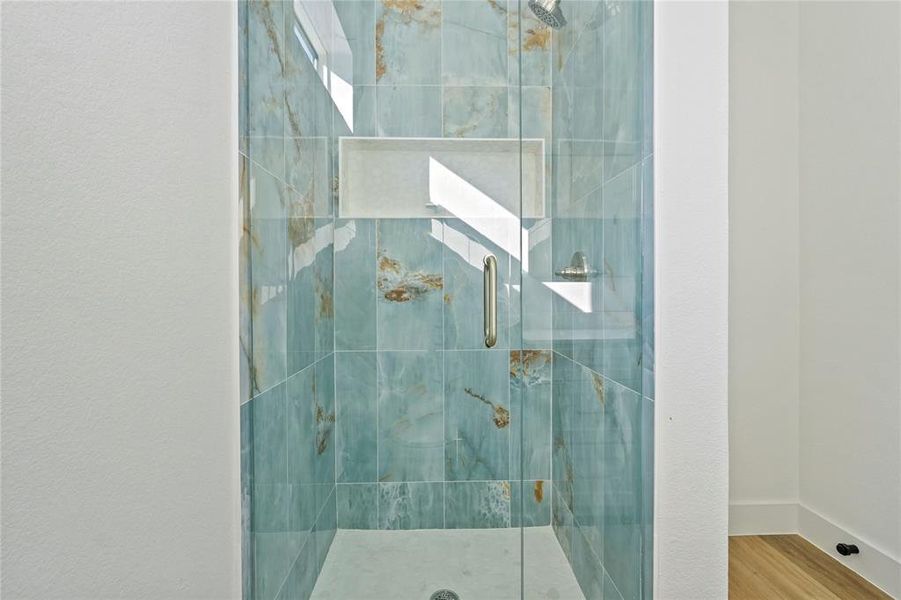 Spacious closet featuring light wood-style flooring