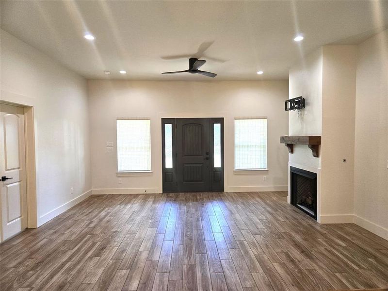 Gorgeous Living room with Fireplace center piece, high ceilings and can lighting. Open Floor Plan Concept not staged for showings Gorgeous Living room with Fireplace center piece, high ceilings and can lighting. Open Floor Plan Concept not staged for showings