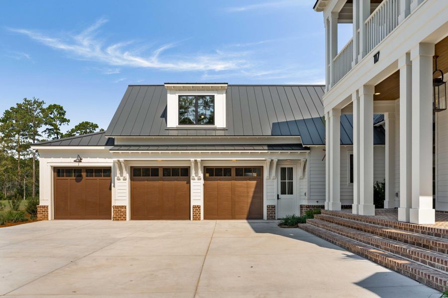 Front exterior of a new home in , Ravenel, SC, highlighting curb appeal (Image 33).